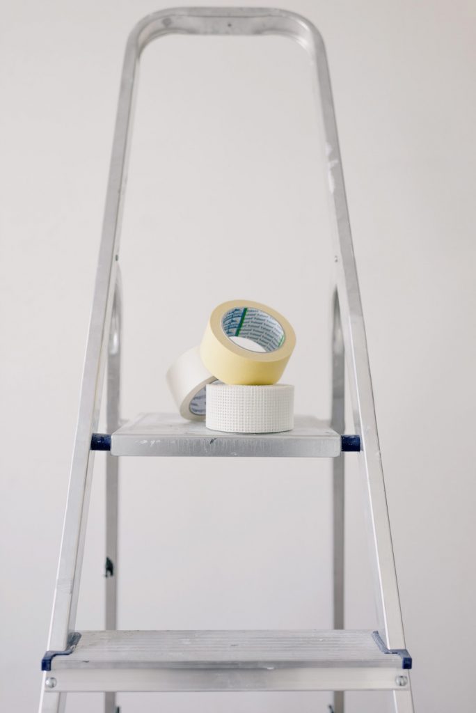 The equipment of a water damage contractor sits on a stool.